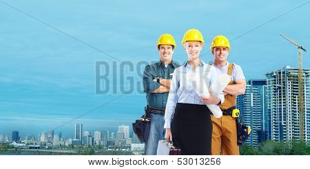 Group of builders workers. Construction industry background.