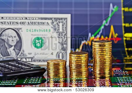 Uptrend Financial Chart,calculator,  One-dollar Banknote And Stacks Of Golden Coins . Selective Focu