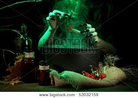  Witch in scary Halloween laboratory on dark color background