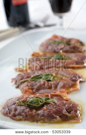 Saltimbocca alla Romana on a rustic table