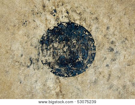 Drumhead With A Black Dot In The Middle.
