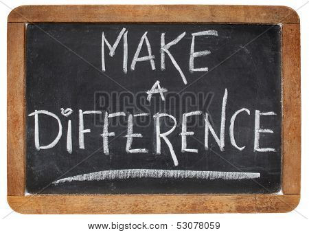 make a difference -motivational phrase - white chalk handwriting on a vintage slate blackboard