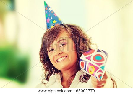 Young woman in business siut wearing party favors