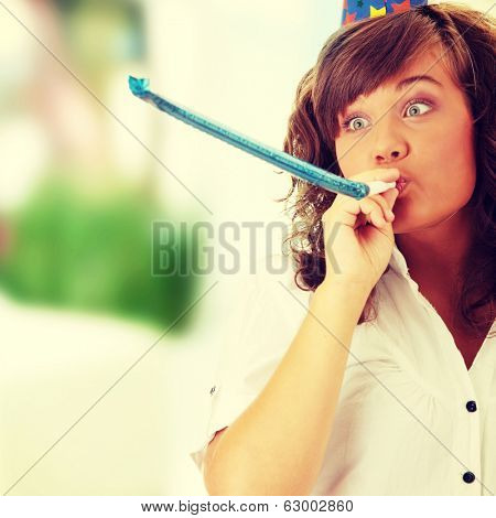 Young woman in business siut wearing party favors