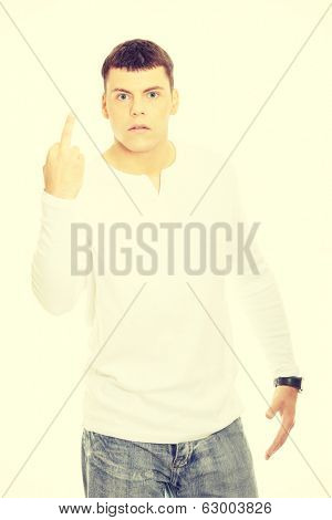 Young man showing middle finger
