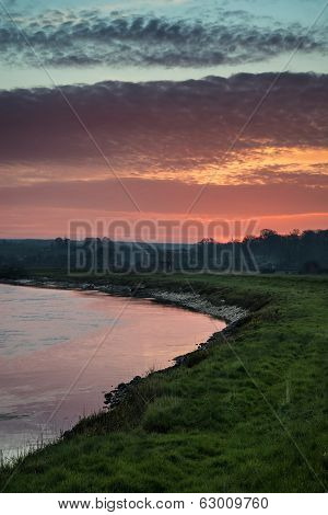 Stunning Vibrant Sunrise Reflected In Calm River