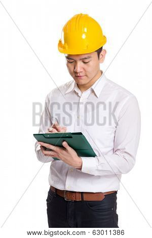 Asia engineer recording something on clipboard