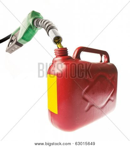 Pouring gasoline in a red jerrycan with a green nozzle on white