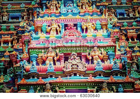MADURAI, INDIA - FEBRUARY 16, 2013: Vintage retro hipster style image of Sculptures on Hindu temple gopura (tower) in Meenakshi Amman Temple - historic Hindu temple located in temple city Madurai