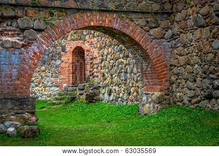 Stone Arch And Wall In Internal Courtyard