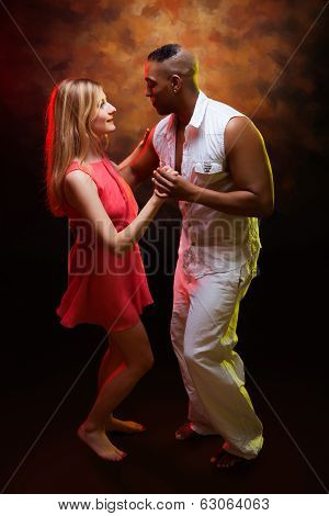 Young couple dances Caribbean Salsa