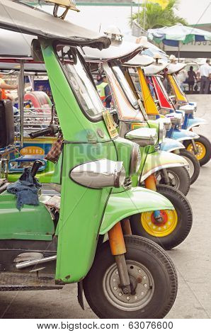Tuk Tuks parked in a row, Bangkok