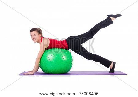 Young woman exercising with swiss ball
