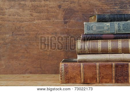 old books on wooden shelf.