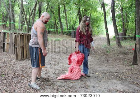 MUSKOGEE, OK - Sept. 13: A bloody zombie looks for runners during the Castle Zombie Run at the Castle of Muskogee in Muskogee, OK on September 13, 2014. 