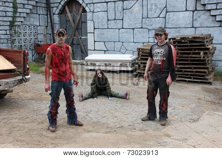 MUSKOGEE, OK - Sept. 13: Bloody zombies wait for the start of the Castle Zombie Run at the Castle of Muskogee in Muskogee, OK on September 13, 2014. 