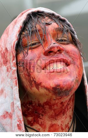 MUSKOGEE, OK - Sept. 13: A bloody zombie looks for runners during the Castle Zombie Run at the Castle of Muskogee in Muskogee, OK on September 13, 2014. 