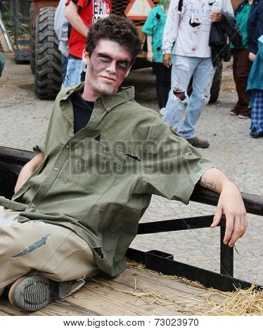 MUSKOGEE, OK - Sept. 13: Bloody zombies wait for the start of the Castle Zombie Run at the Castle of Muskogee in Muskogee, OK on September 13, 2014. 