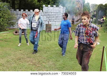 MUSKOGEE, OK - Sept. 13: A bloody zombie looks for runners during the Castle Zombie Run at the Castle of Muskogee in Muskogee, OK on September 13, 2014. 