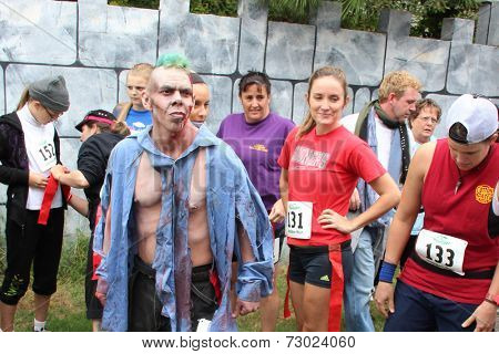 MUSKOGEE, OK - Sept. 13: Bloody zombies wait for the start of the Castle Zombie Run at the Castle of Muskogee in Muskogee, OK on September 13, 2014. 