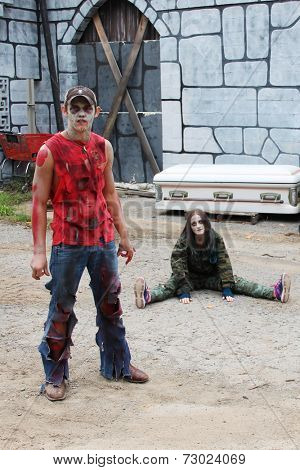 MUSKOGEE, OK - Sept. 13: Bloody zombies wait for the start of the Castle Zombie Run at the Castle of Muskogee in Muskogee, OK on September 13, 2014. 