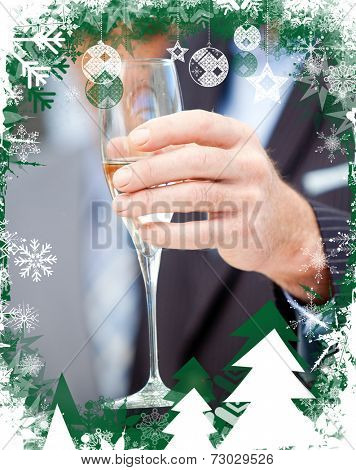 Close up of a businessman holding a glass of Champagne against christmas themed frame