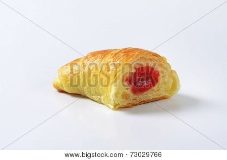 halved buttery croissant with fruit filling