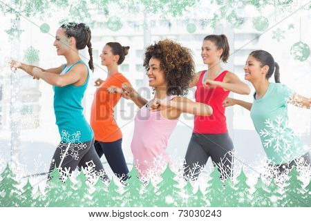 Composite image of snow frame against zumba class in gym