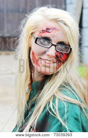 MUSKOGEE, OK - Sept. 13: A bloody zombie looks waits for runners during the Castle Zombie Run at the Castle of Muskogee in Muskogee, OK on September 13, 2014. 