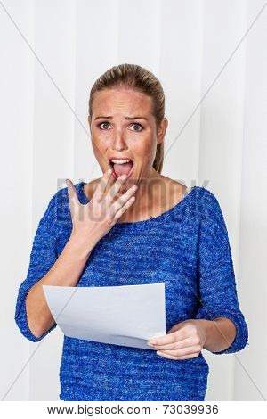 a young woman gets bad news in a letter in the mail