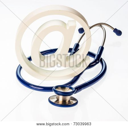 an e-mail sign and a stethoscope on a white background. symbol photo for internet in the doctor's office.