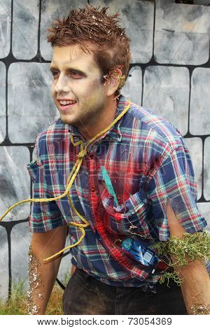 MUSKOGEE, OK - Sept. 13: Bloody zombies wait for runners to attack during the Castle Zombie Run at the Castle of Muskogee in Muskogee, OK on September 13, 2014. 
