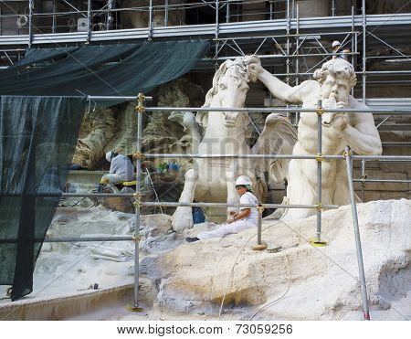 ROME, ITALY - SEPTEMBER 22, 2014: Famous Trevi Fountain (Fontana di Trevi) under restoration.