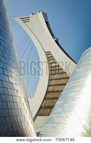 MONTREAL  CANADA - SEPT 05: Olympic stadium between modern buildings on september 05, 2014 in MONTREAL
