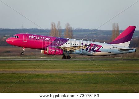 BUDAPEST, HUNGARY - MAY 5: Wizzair A320 landing at Budapest Liszt Ferenc Airport, May 5th 2014. Budapest is one of Wizzair's most important bases.