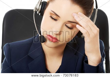 Portrait of anoyed support phone operator in headset