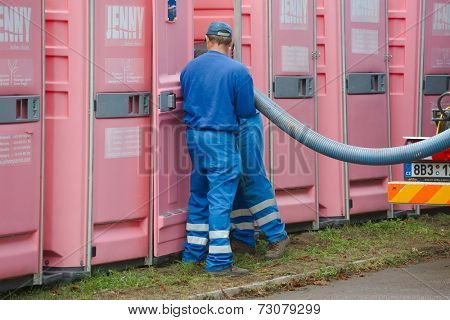 HODONIN, CZECH REPUBLIC - AUGUST 17: Cleaning of the mobile toilets at Made of Metal, August 17th 2014.