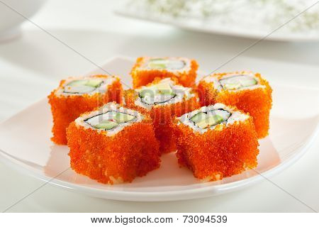 California Maki Sushi with Masago  - Roll made of Crab Meat, Avocado, Cucumber inside. Smelt roe outside