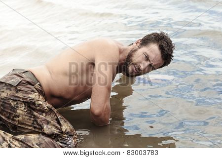 Handsome Shirtless Army Crawling At Sea Water
