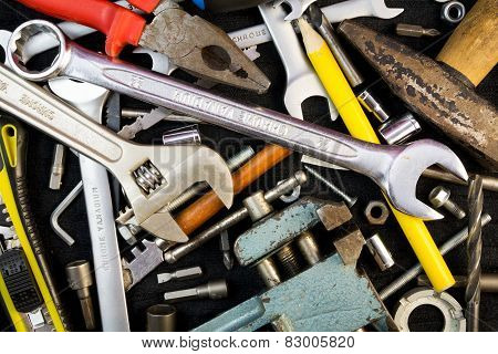Set of tools on black background
