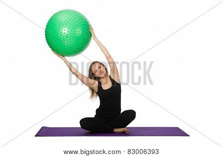 Young woman exercising with swiss ball