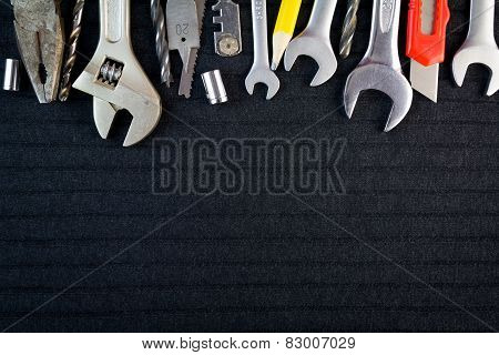 Set of tools on black background