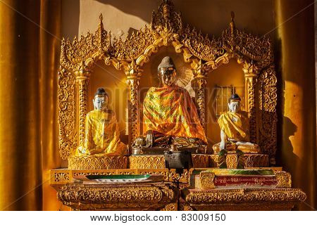 Buddha statues in Burma famous sacred place and tourist attraction landmark - Shwedagon Paya pagoda. Yangon, Myanmar