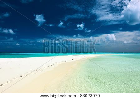 Beautiful island beach with sandspit at Maldives