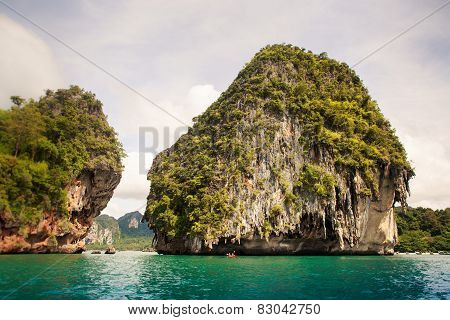 Cliffy Island In Azure Sea Water