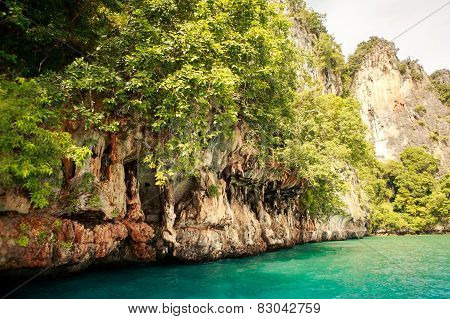 Cliffy Island In Azure Sea Water