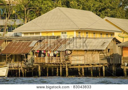 Rundown homes by Chao Praya River in Bangkok, Thailand
