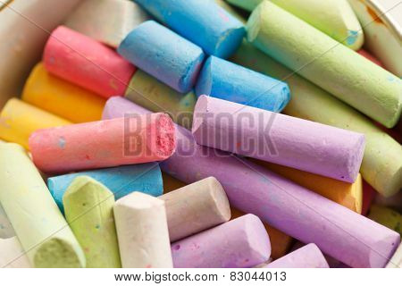 Colorful crayons for drawing on the pavement close-up