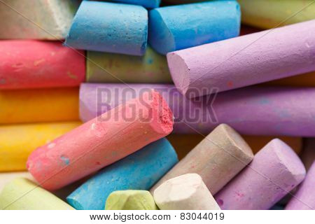 Colorful crayons for drawing on the pavement close-up