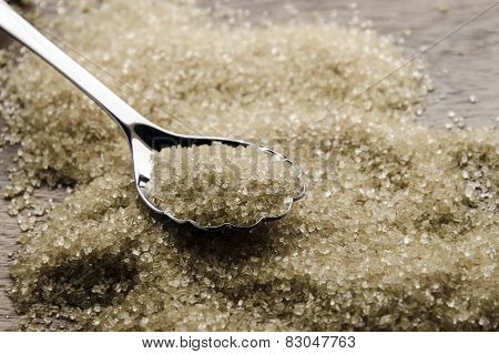 brown cane sugar with silver spoon